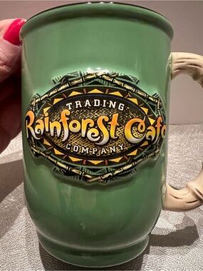 Rainforest Cafe 3D Logo Ceramic Coffee Mug Simulated Bamboo Handle 16 oz Green.